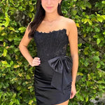 KissDress Strapless Appliques Ruched Homecoming Dress with Bow | This dress is designed in a chic sheath silhouette that hugs your curves beautifully while offering a comfortable fit.