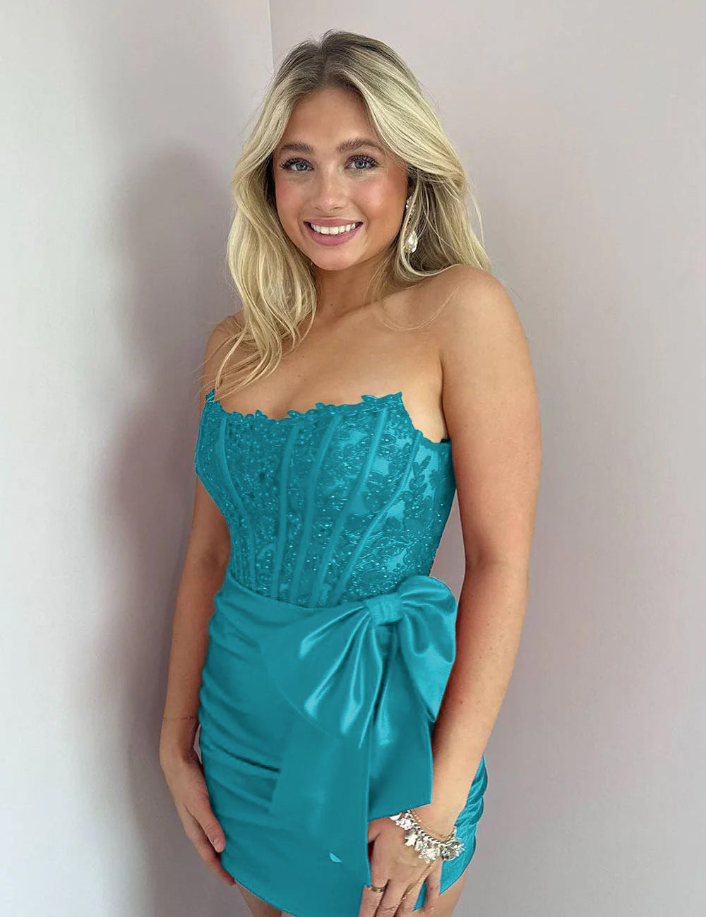 KissDress Strapless Appliques Ruched Homecoming Dress with Bow | This dress is designed in a chic sheath silhouette that hugs your curves beautifully while offering a comfortable fit.