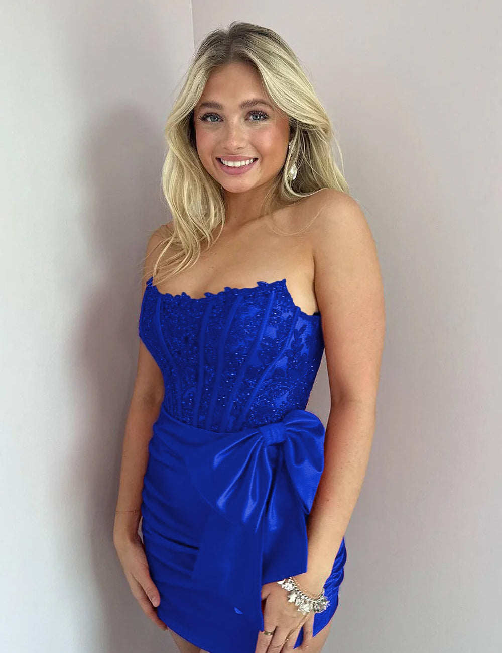 KissDress Strapless Appliques Ruched Homecoming Dress with Bow | This dress is designed in a chic sheath silhouette that hugs your curves beautifully while offering a comfortable fit.